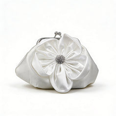 White satin evening bag with floral and rhinestone embellishments.